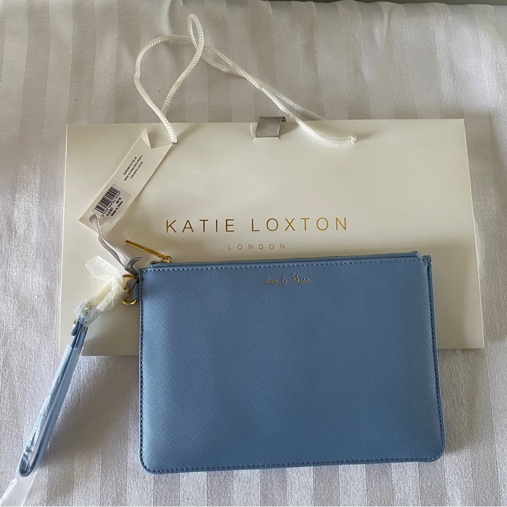 Katie Loxton blue with original gift bag. New with tags. 9 1/2” x 6 1/2”.
